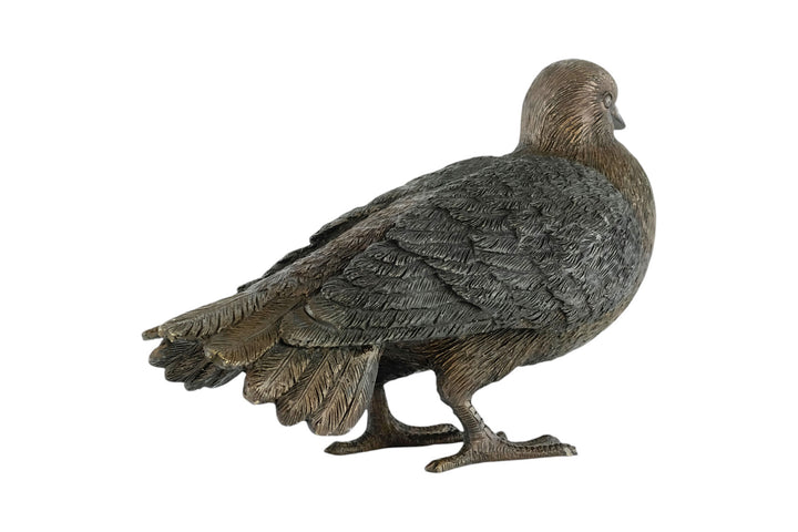 Bronze sculpture of a standing pigeon