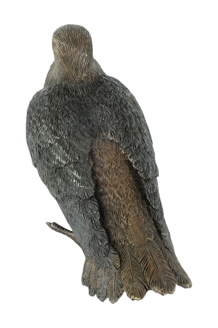 Bronze sculpture of a standing pigeon