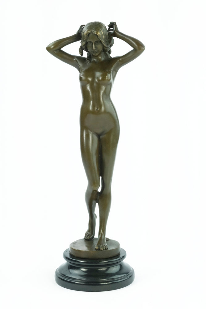 Bronze sculpture of a female nude playing with her hair
