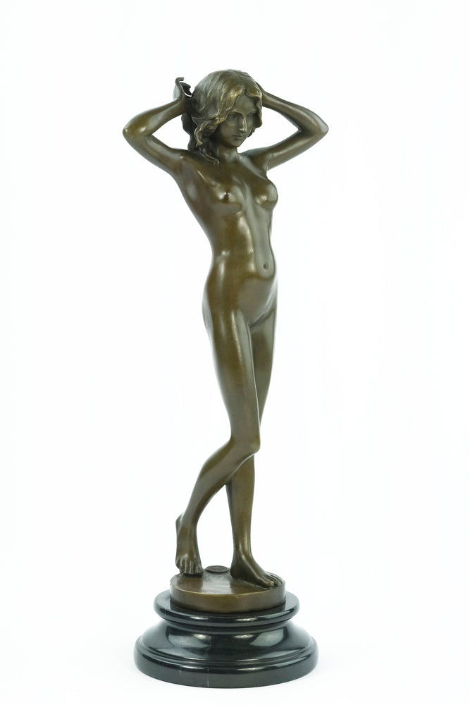 Bronze sculpture of a female nude playing with her hair