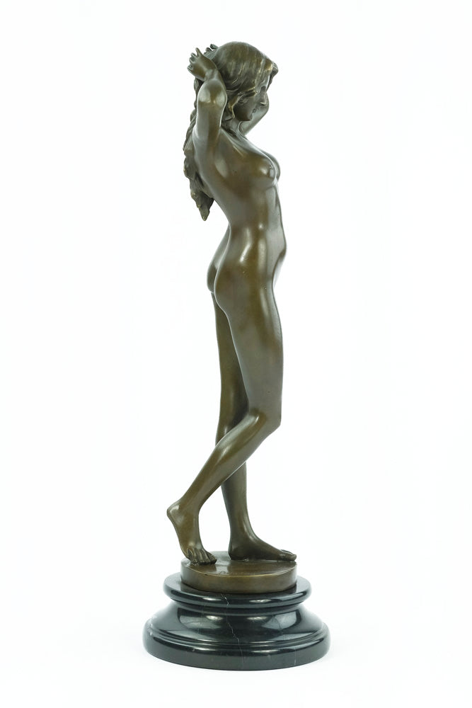 Bronze sculpture of a female nude playing with her hair