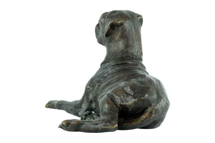 Bronze sculpture of a reclining boxer dog