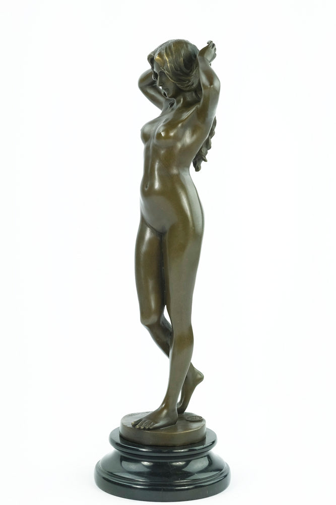 Bronze sculpture of a female nude playing with her hair
