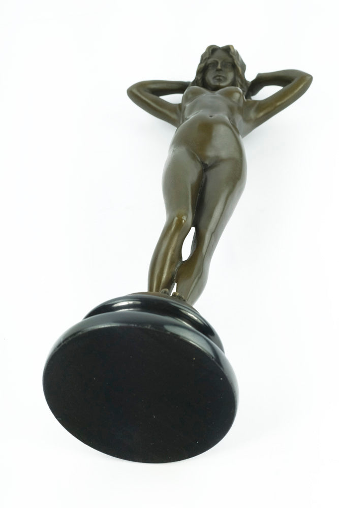 Bronze sculpture of a female nude playing with her hair