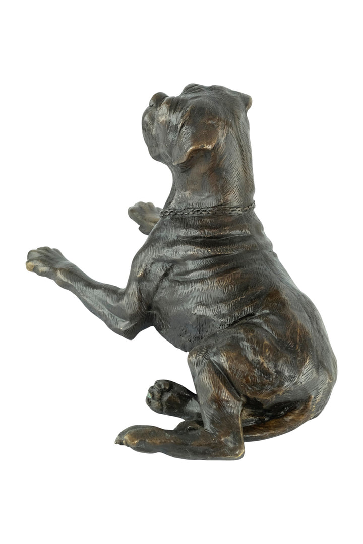 Bronze sculpture of a reclining boxer dog