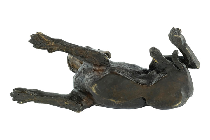 Bronze sculpture of a reclining boxer dog