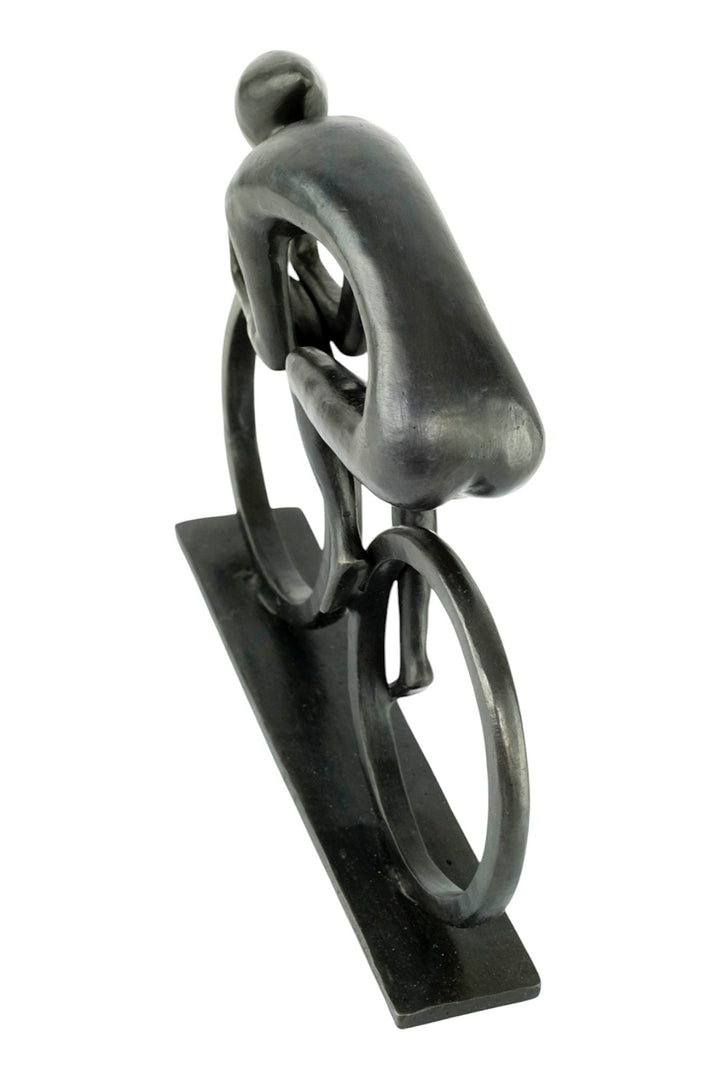 Modern bronze sculpture of a cyclist at full speed