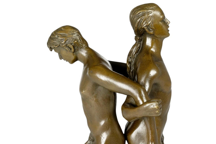Bronze sculpture of a male couple standing back to back