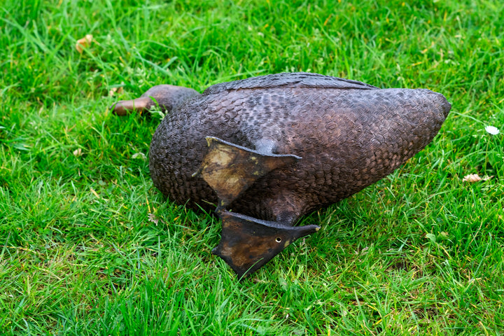 Large bronze sculpture of a standing duck