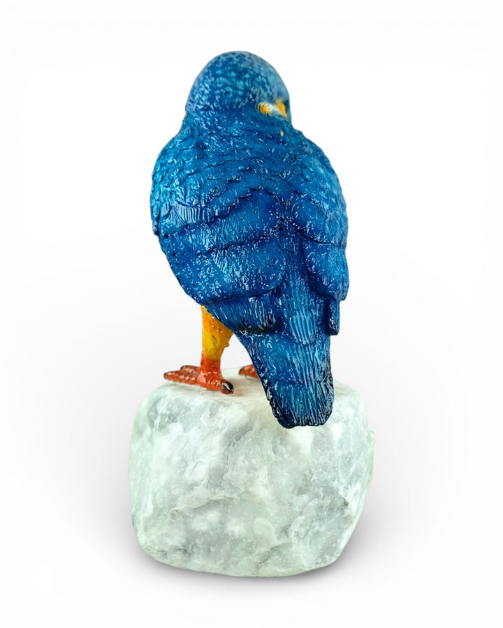 Painted bronze sculpture of a kingfisher on a rock