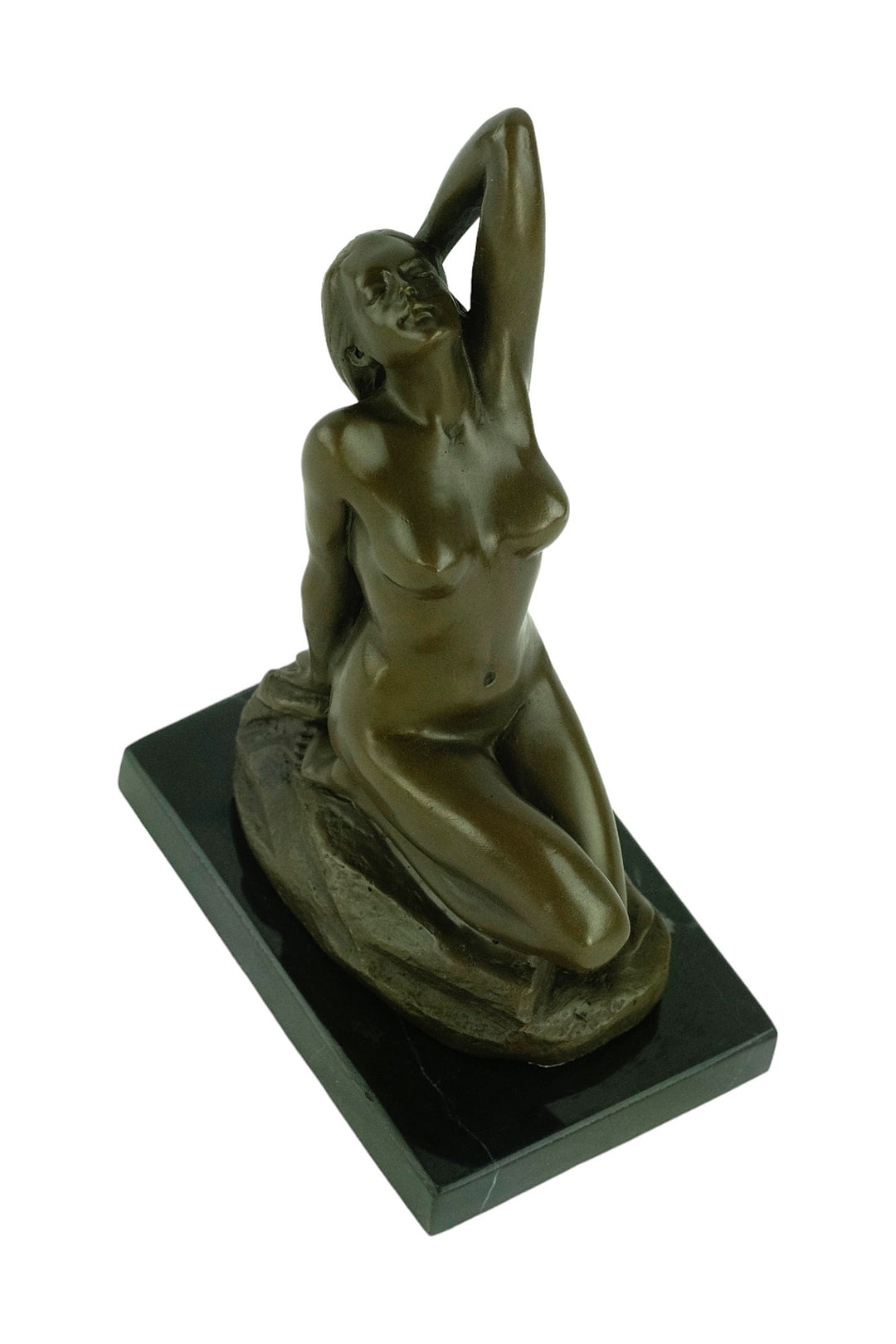 Bronze sculpture of a sensual female nude kneeling on a rock