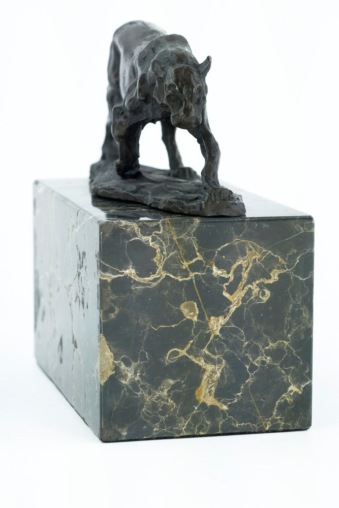 Bronze sculpture of a walking panther