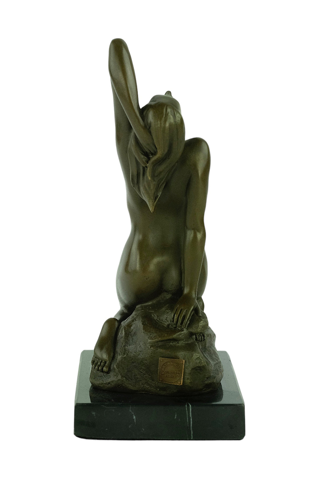 Bronze sculpture of a sensual female nude kneeling on a rock