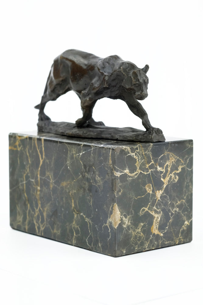 Bronze sculpture of a walking panther