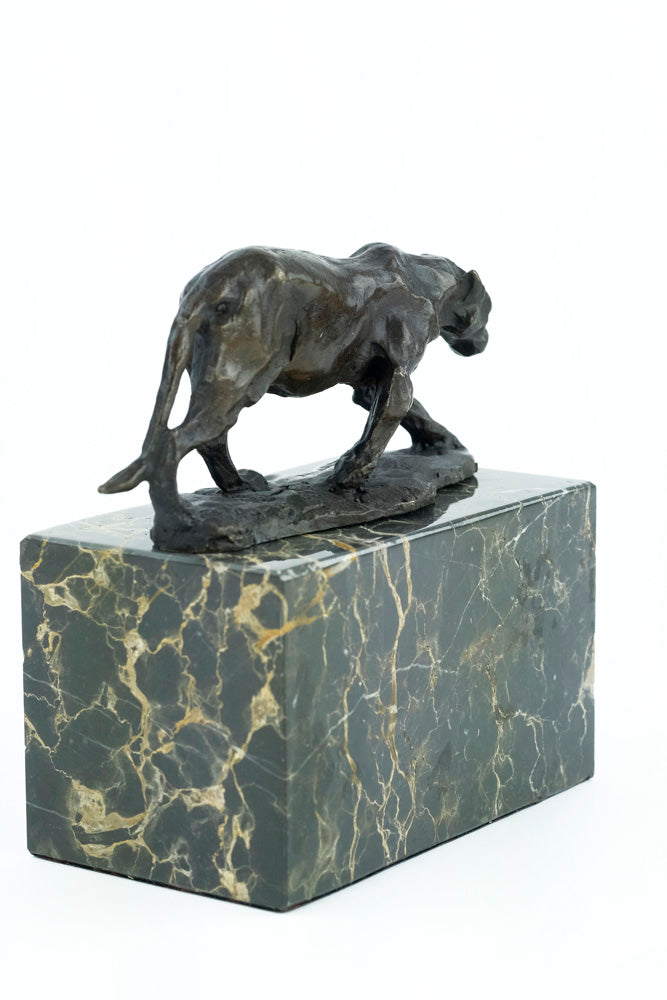 Bronze sculpture of a walking panther