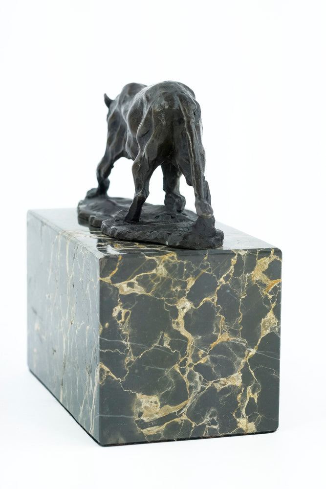 Bronze sculpture of a walking panther