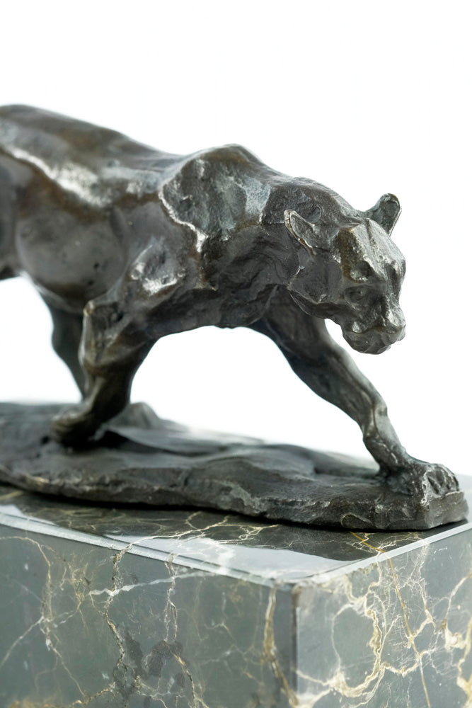 Bronze sculpture of a walking panther