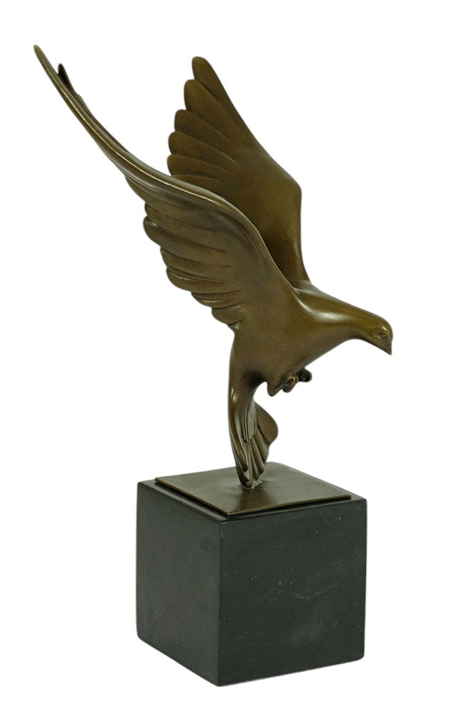 Bronze sculpture of a pigeon descending with wings spread