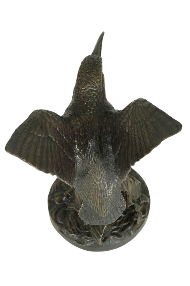 Bronze sculpture of a king fisher with wings spread