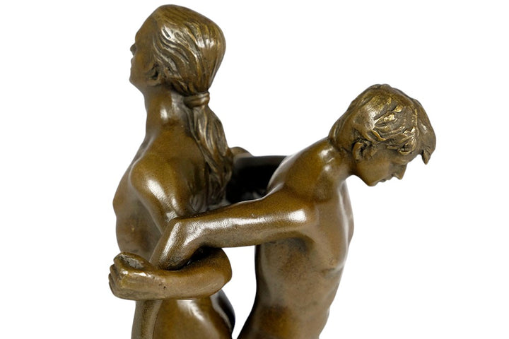 Bronze sculpture of a male couple standing back to back