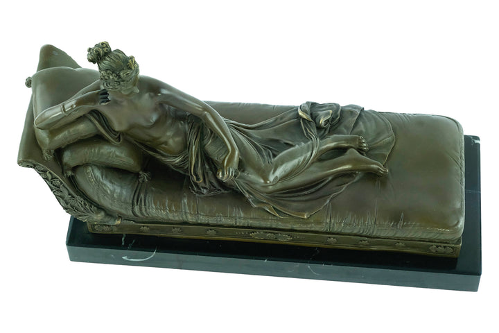 Bronze statue of Pauline Bonaparte reclining on a chaise longue, inspired by Venus Triumphant, detailed classic art.