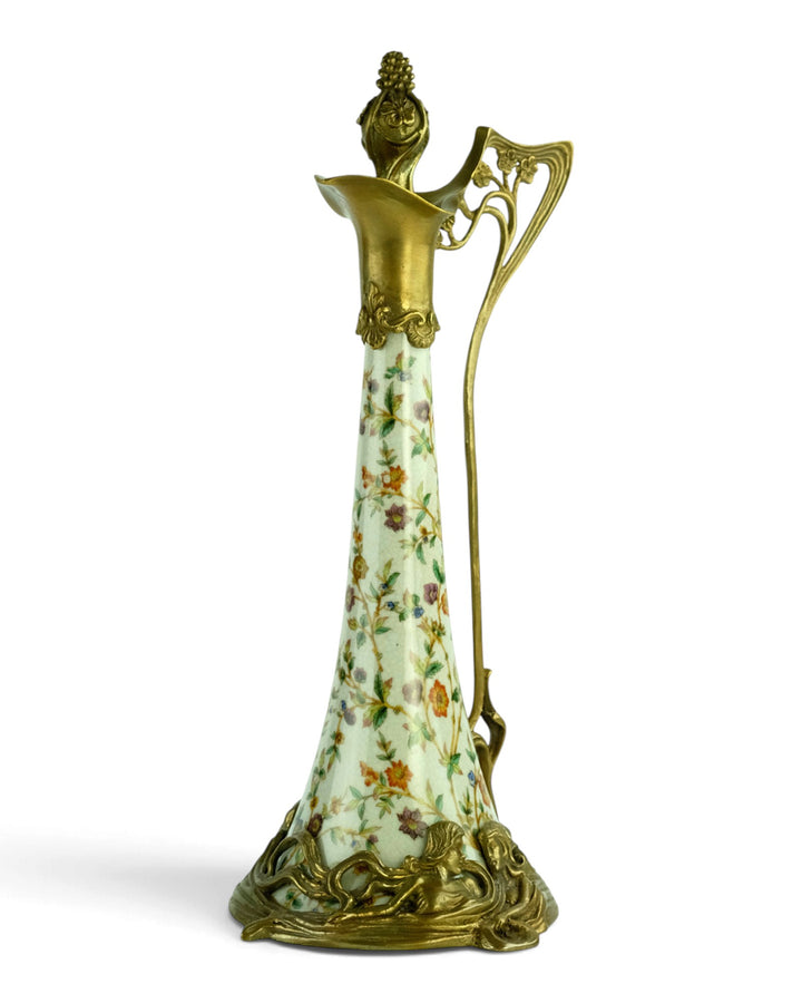 Bronze mounted porcelain claret jug with flower decoration