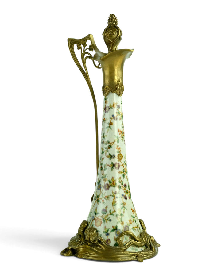 Bronze mounted porcelain claret jug with flower decoration