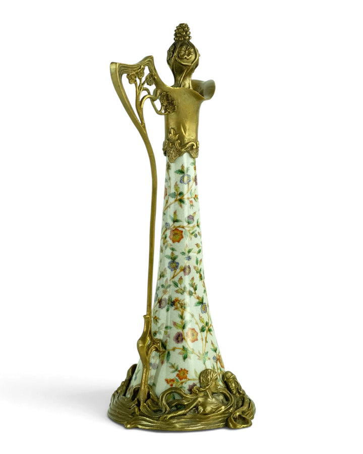 Bronze mounted porcelain claret jug with flower decoration