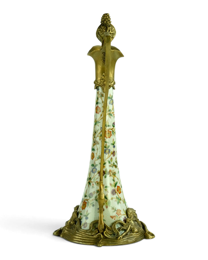 Bronze mounted porcelain claret jug with flower decoration