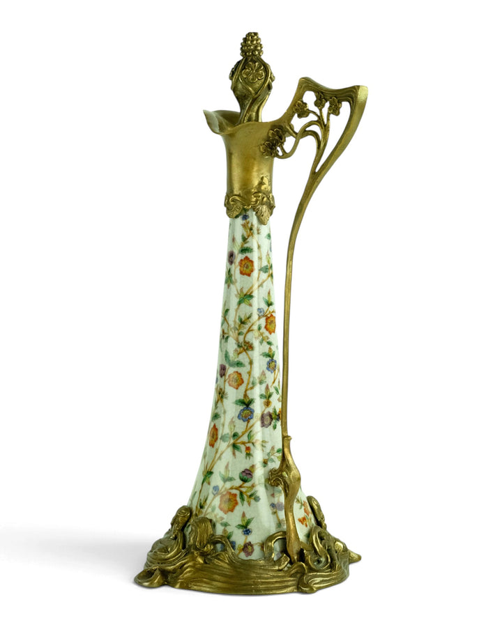 Bronze mounted porcelain claret jug with flower decoration