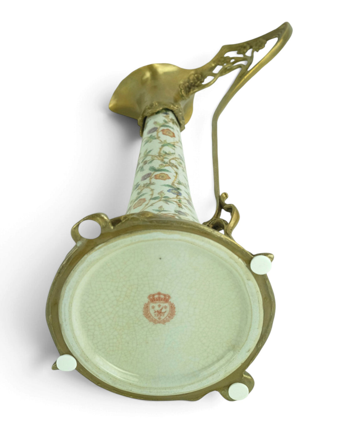 Bronze mounted porcelain claret jug with flower decoration