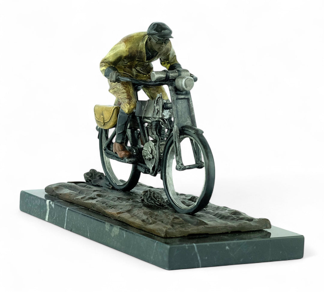 Bronze sculpture of an early moped rider