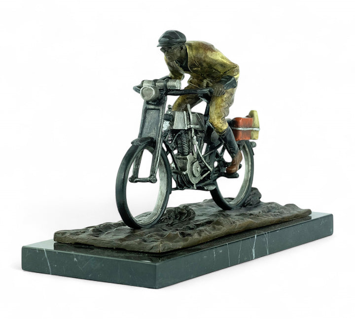 Bronze sculpture of an early moped rider