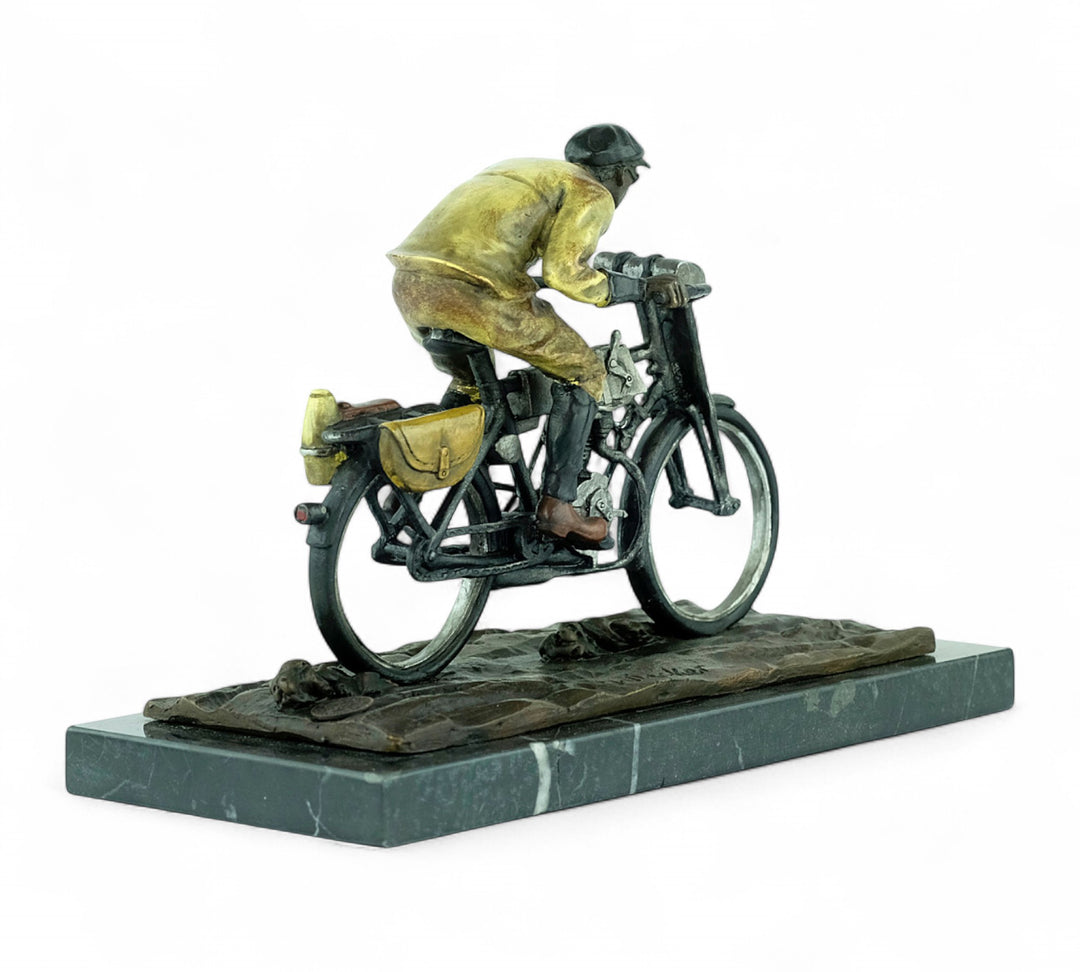 Bronze sculpture of an early moped rider
