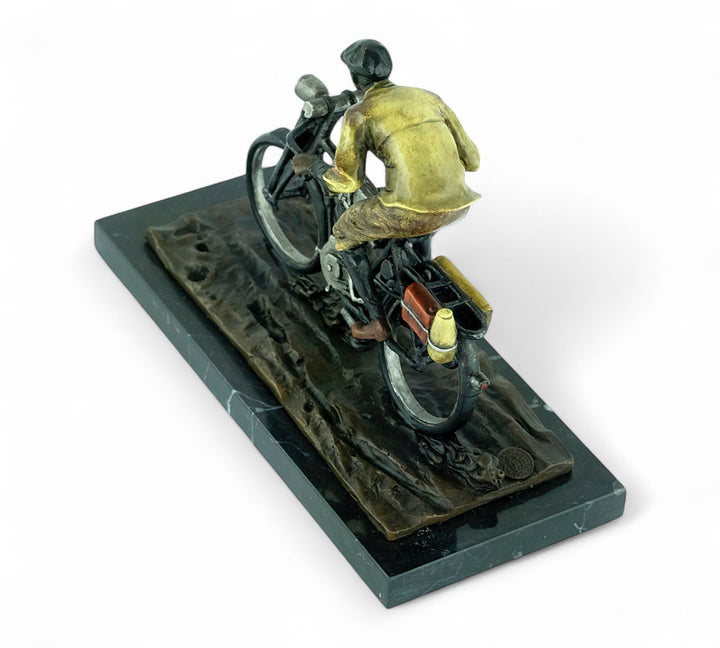Bronze sculpture of an early moped rider