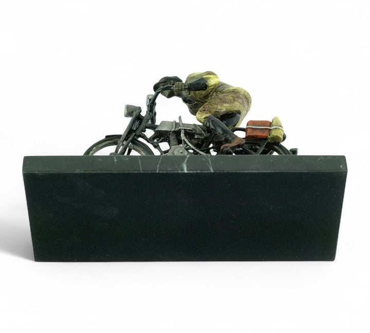 Bronze sculpture of an early moped rider