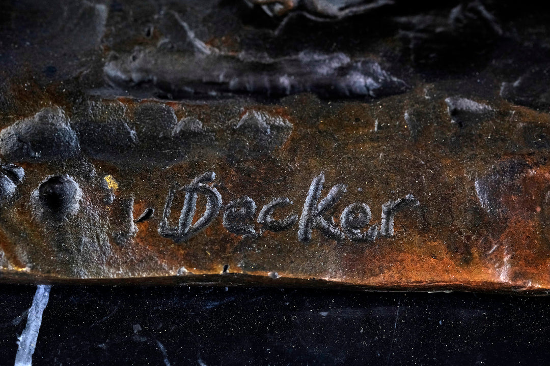 Bronze sculpture of an early moped rider