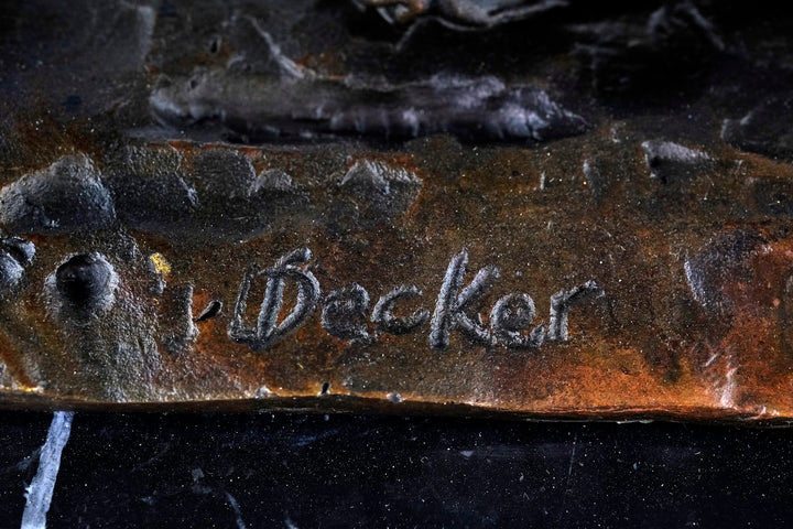 Bronze sculpture of an early moped rider