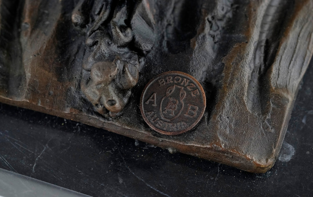 Bronze sculpture of an early moped rider