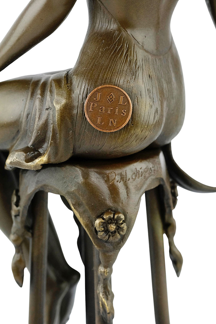 Bronze sculpture of a female on a barstool wearing a sensual dress