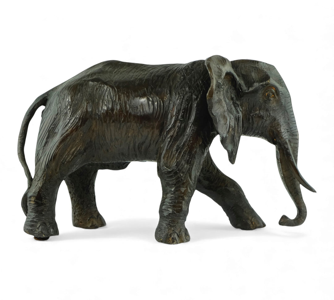 Vintage bronze sculpture of a walking African elephant