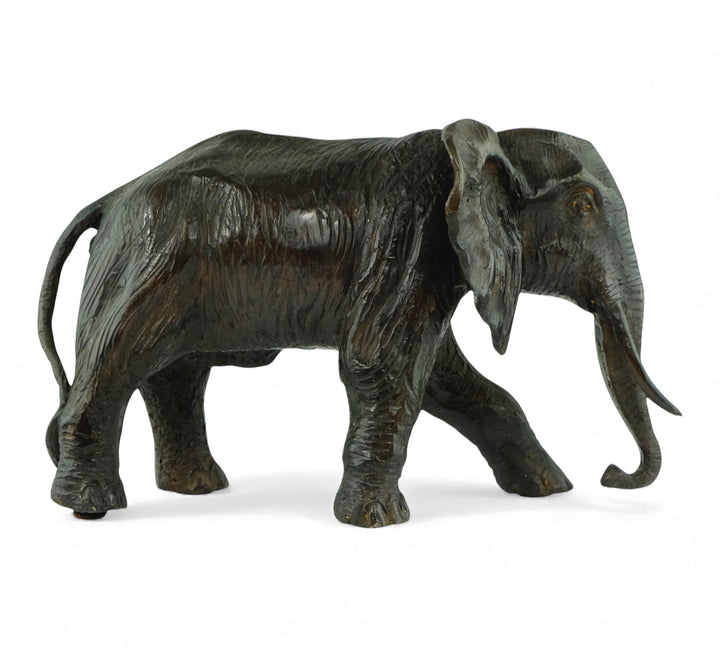 Vintage bronze sculpture of a walking African elephant