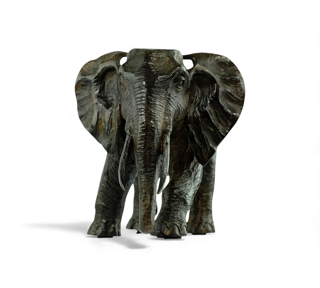 Vintage bronze sculpture of a walking African elephant