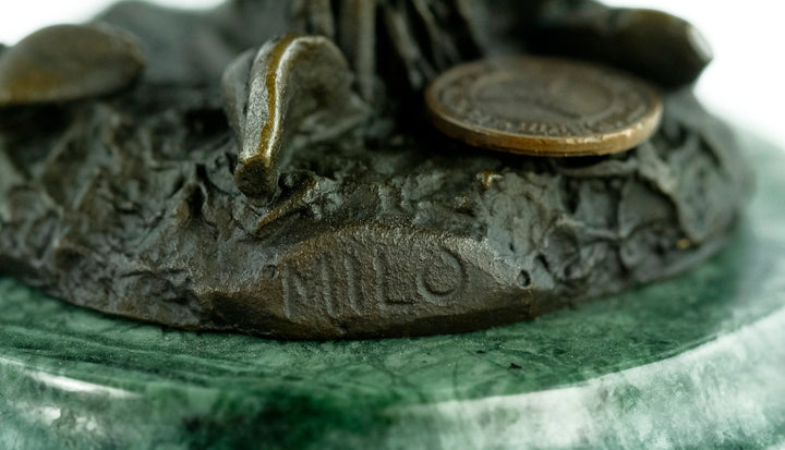 Bronze sculpture of a little winged fairy standing