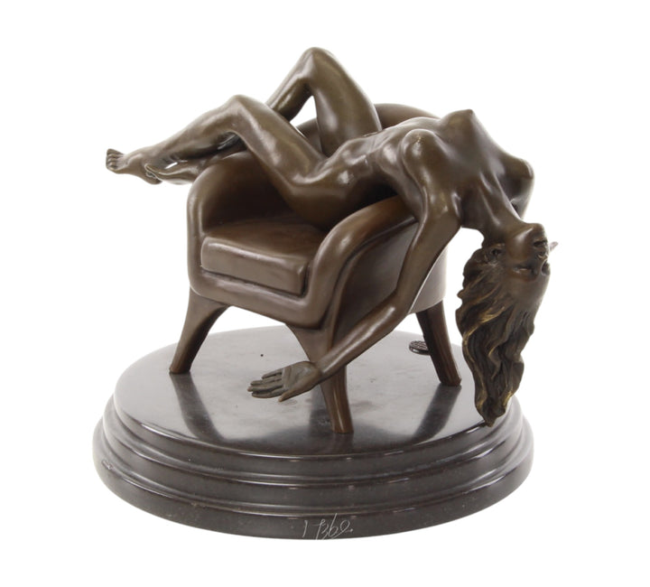 Bronze sculpture of a female nude laying on a chair