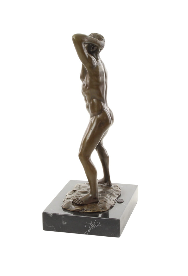 Bronze sculpture of a posing mascular male holding his phallus
