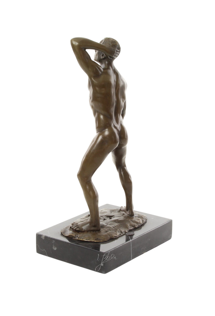 Bronze sculpture of a posing mascular male holding his phallus