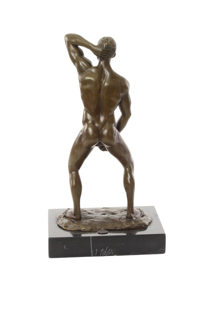 Bronze sculpture of a posing mascular male holding his phallus