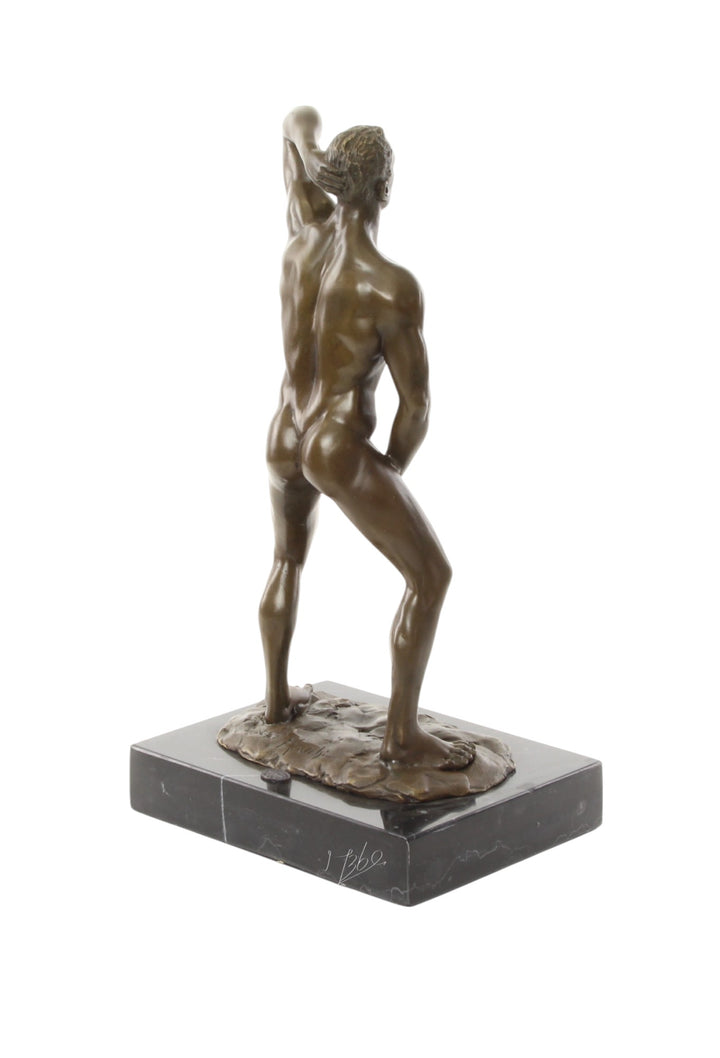 Bronze sculpture of a posing mascular male holding his phallus