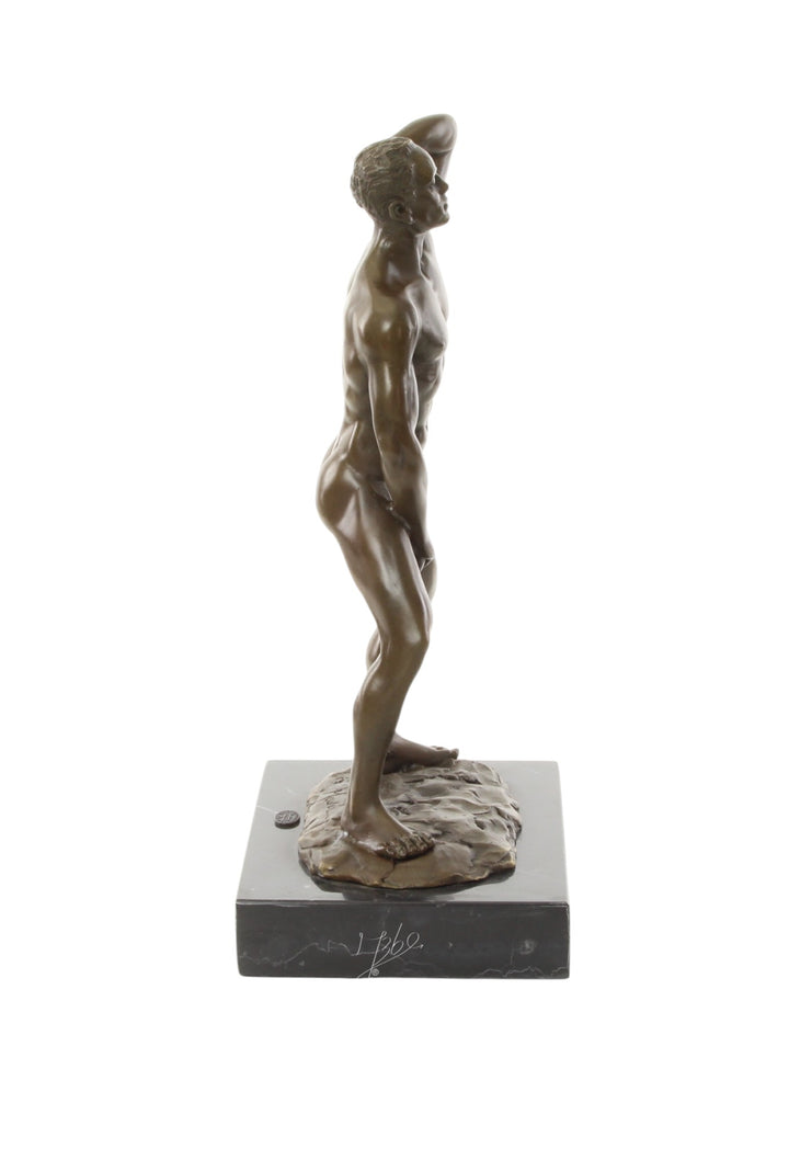 Bronze sculpture of a posing mascular male holding his phallus